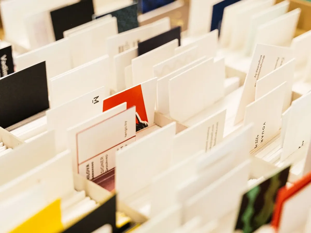 Stock photo: printed business cards in a box, a product companies reorder for their staff