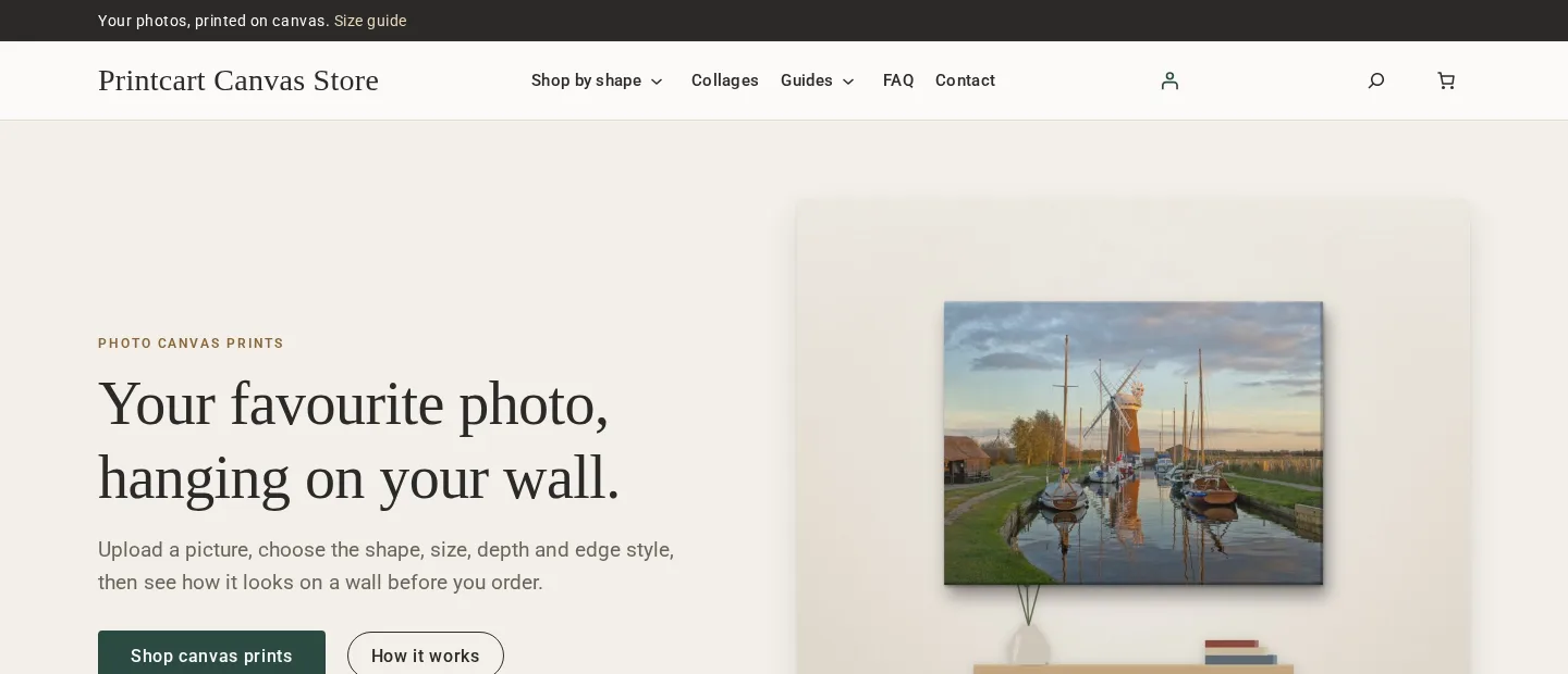 Home page of the Printcart canvas demo store: a photo canvas hanging on a wall above a table