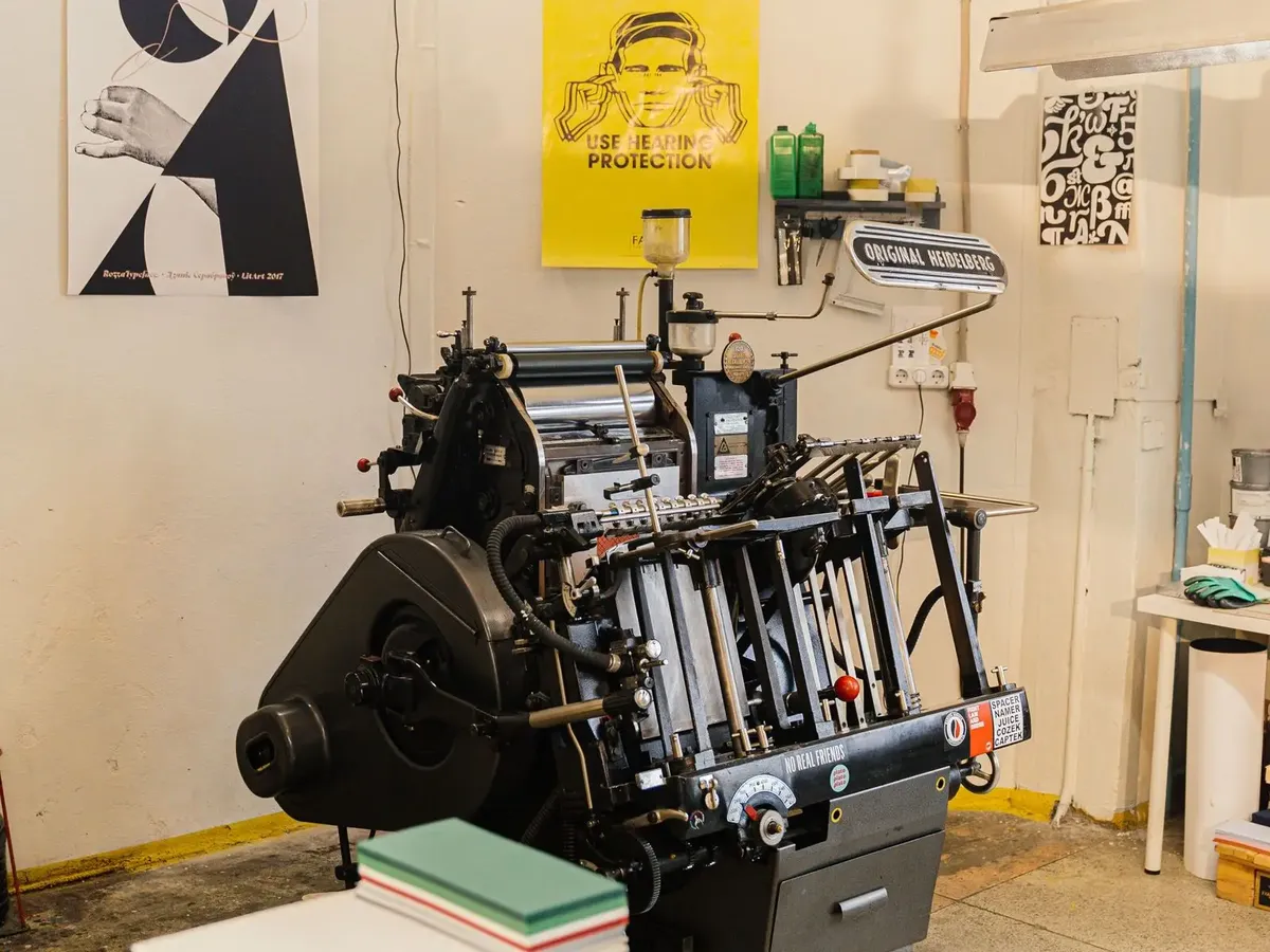 Stock photo: a print studio with a press and posters, one of the print providers that can sell on a marketplace