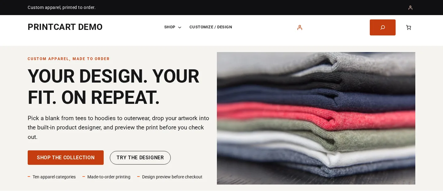 Home page hero of the Printcart apparel demo store with Shop the collection and Try the designer buttons